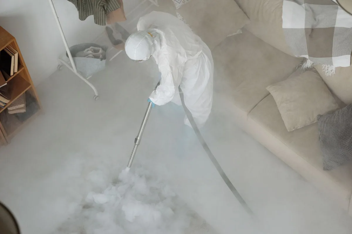 Biohazard cleanup technician in protective equipment, Atlantic Station, Atlanta, GA